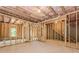 Large unfinished basement with framed walls and windows for natural light, ready for your vision at 6462 Beaver Creek Trl, Atlanta, GA 30349
