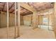 Spacious unfinished basement with studded walls and roughed-in plumbing ready for customization at 6462 Beaver Creek Trl, Atlanta, GA 30349
