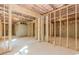 Expansive unfinished basement ready for customization, featuring studded walls and a concrete foundation at 6462 Beaver Creek Trl, Atlanta, GA 30349