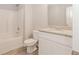 Bathroom featuring a tub/shower combo, toilet, and vanity with granite countertop at 6462 Beaver Creek Trl, Atlanta, GA 30349