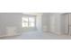 Bright bonus room with large windows and neutral carpet at 6462 Beaver Creek Trl, Atlanta, GA 30349