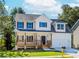 Charming two-story home with a covered front porch and a well-manicured lawn at 6462 Beaver Creek Trl, Atlanta, GA 30349