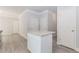 Bright kitchen with granite countertop island and modern gray wood floors at 6462 Beaver Creek Trl, Atlanta, GA 30349
