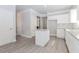 New kitchen featuring white cabinets, granite countertops, stainless appliances, and gray floors at 6462 Beaver Creek Trl, Atlanta, GA 30349