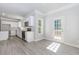 Beautiful open kitchen with stainless steel appliances and access to back deck through glass door at 6462 Beaver Creek Trl, Atlanta, GA 30349