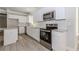 Beautiful kitchen with white cabinets, stainless steel appliances, and granite countertops at 6462 Beaver Creek Trl, Atlanta, GA 30349