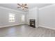 Open-concept living room with modern flooring, fireplace and natural light at 6462 Beaver Creek Trl, Atlanta, GA 30349