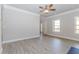 Cozy living room with modern flooring, neutral walls, and a ceiling fan at 6462 Beaver Creek Trl, Atlanta, GA 30349