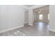 Spacious living room with modern flooring and an open layout, leading to other rooms at 6462 Beaver Creek Trl, Atlanta, GA 30349