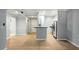Spacious living room with hardwood floors leading to a modern kitchen featuring stainless steel appliances at 2700 Pine Tree Ne Rd # 1007, Atlanta, GA 30324