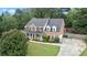 Well-maintained brick home with lush green lawn, mature trees, and long driveway, perfect for outdoor enjoyment at 1500 Terminal Ct, Mcdonough, GA 30252