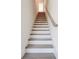 Wooden stairs with white risers and stringers lead to the next level at 1239 Chelsea Nw Cir, Atlanta, GA 30318