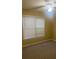 Bright bedroom with neutral walls, carpet, and window blinds at 5110 Martin Farms Ln, Powder Springs, GA 30127