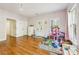 Spacious bedroom with hardwood floors, ample natural light, and playful decor offers versatile design possibilities at 3127 Lenox Road # 6, Atlanta, GA 30324