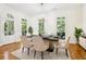 Elegant dining room with marble table, hardwood floors, and plenty of natural light at 3127 Lenox Road # 6, Atlanta, GA 30324