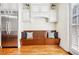 A kitchen pantry features a stainless steel refrigerator, bench, and hardwood floors at 3127 Lenox Road # 6, Atlanta, GA 30324