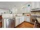 Modern kitchen featuring stainless steel appliances, granite countertops, and ample white cabinets at 3127 Lenox Road # 6, Atlanta, GA 30324