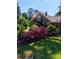 This home's exterior shows a balcony with stairs, flower bushes, and green lawn at 133 Hillside Se Ave, Atlanta, GA 30315