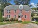 A charming brick home with a gravel driveway and lush lawn at 133 Hillside Se Ave, Atlanta, GA 30315