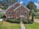 Charming brick home with a lush green lawn and mature landscaping at 133 Hillside Se Ave, Atlanta, GA 30315