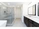 Modern bathroom with a glass enclosed shower and dual sink vanity with granite countertops at 1254 Red Oak Blvd, Loganville, GA 30052