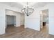 Formal dining room with coffered ceiling, wainscoting, and a modern chandelier at 1254 Red Oak Blvd, Loganville, GA 30052