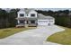 Stunning two-story home with a long driveway and a three-car garage, set in a beautiful neighborhood at 1254 Red Oak Blvd, Loganville, GA 30052