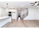 Spacious living area featuring wood floors, a staircase, recessed lighting and an open floor plan at 1254 Red Oak Blvd, Loganville, GA 30052