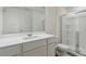 Stylish bathroom with white countertops, a glass-enclosed shower, and modern fixtures at 2688 Toucan Way, Atlanta, GA 30331