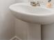 Elegant pedestal sink in a well-lit bathroom at 2688 Toucan Way, Atlanta, GA 30331