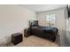 Bedroom featuring carpet, a window with blinds, and dark-colored furniture at 2688 Toucan Way, Atlanta, GA 30331