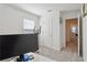 Minimalist bedroom with a bright window, an exercise machine, and a work desk at 2688 Toucan Way, Atlanta, GA 30331