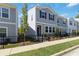Charming gray two-story home with black shutters, black iron fence, and manicured lawn at 2688 Toucan Way, Atlanta, GA 30331