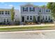 Charming two-story home with a manicured lawn and black iron fence on a sunny day at 2688 Toucan Way, Atlanta, GA 30331