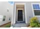 Stylish front door with visible house number in front of a two-story gray home at 2688 Toucan Way, Atlanta, GA 30331