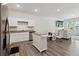 Modern kitchen with stainless steel appliances and a view of the living area at 2688 Toucan Way, Atlanta, GA 30331