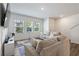 Bright living room with large window, hardwood flooring, and comfortable seating at 2688 Toucan Way, Atlanta, GA 30331