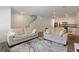 Bright living room with modern furniture and hardwood floors, flowing into the kitchen at 2688 Toucan Way, Atlanta, GA 30331
