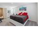 Spacious bedroom featuring a king-sized bed, soft carpet, and a serene ambiance with a large wall art at 2688 Toucan Way, Atlanta, GA 30331