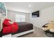 Relaxing bedroom featuring a comfortable bed, a flat-screen TV, and a cozy chair at 2688 Toucan Way, Atlanta, GA 30331