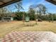 Covered patio with view to a spacious backyard with shed at 9206 Carlton Nw Trl, Covington, GA 30014