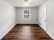 Bedroom featuring hardwood floors, natural light, neutral paint and ample closet space at 9206 Carlton Nw Trl, Covington, GA 30014