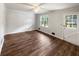 Bright living room with hardwood floors, fresh white paint, and natural light at 9206 Carlton Nw Trl, Covington, GA 30014