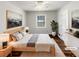 Bright main bedroom featuring natural light, hardwood floors, neutral paint and ample closet space at 9206 Carlton Nw Trl, Covington, GA 30014