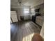 Updated kitchen features modern appliances, grey cabinets, and granite countertops at 6354 Shannon Pkwy # 12F, Union City, GA 30291
