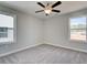 Bedroom with carpet, ceiling fan and windows at 261 Dahlia Dr, Woodstock, GA 30188