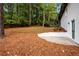 Lush, tree-filled backyard with deck and grass, providing a serene outdoor retreat at 2228 Old Dallas Sw Rd, Marietta, GA 30064