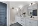 Modern bathroom featuring double sinks, sleek fixtures, and a tiled walk-in shower at 2228 Old Dallas Sw Rd, Marietta, GA 30064