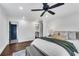 Spacious bedroom features hardwood floors, a walk-in closet, and a blue paneled door at 2228 Old Dallas Sw Rd, Marietta, GA 30064