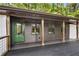 Side view of house with a covered deck, green door, and wood and metal railings at 2228 Old Dallas Sw Rd, Marietta, GA 30064